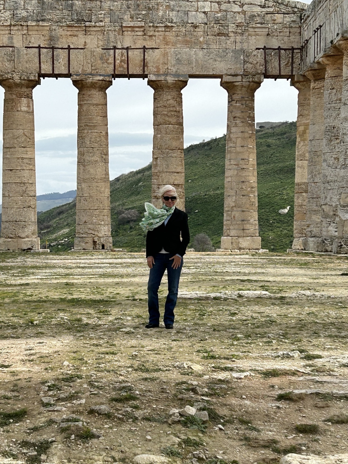 Shari Leigh Roberts among ancient ruins and columns in Sicily, Italy.