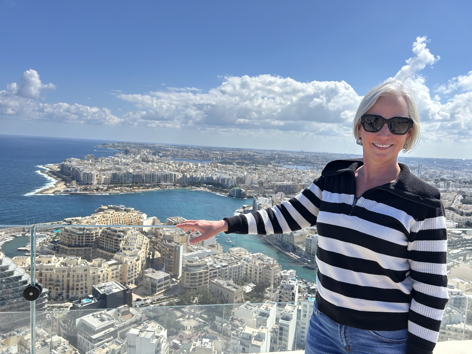 Shari Leigh Roberts at Odyssey Malta in Mercury Tower, St. Julian’s, with panoramic views across Malta.